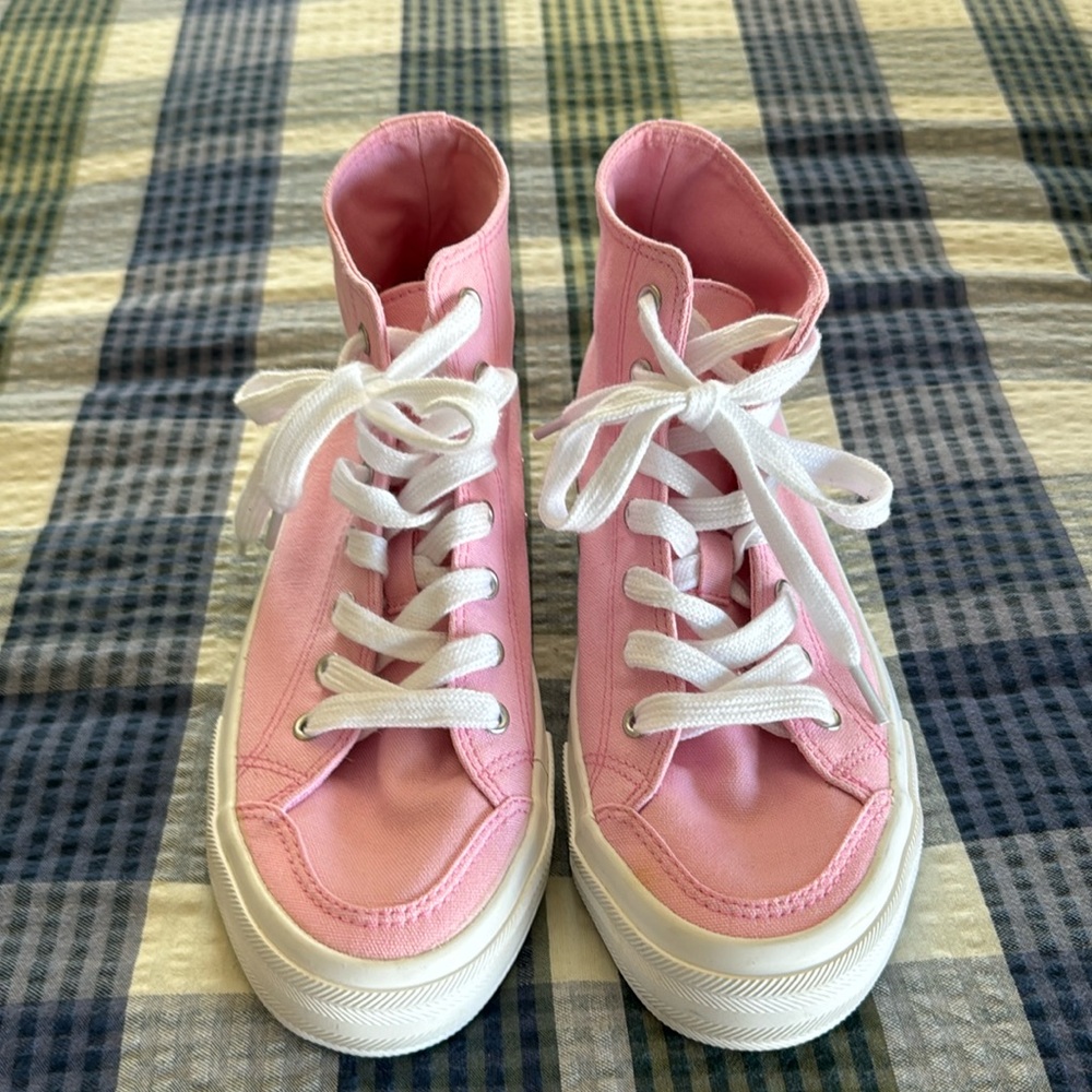 High top pink sneakers.